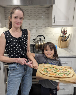 Dr. Pinto and Gio with a finished pizza