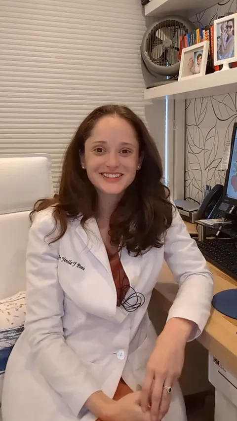 Dr. Pinto explaining how an uneven bite affects your teeth