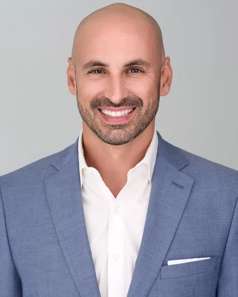 Invisalign Dentist Palmetto Bay Deering Dental in Palmetto Bay, near Pinecrest Peter, Dr. Pinto's husband, smiling after his Invisalign treatment
