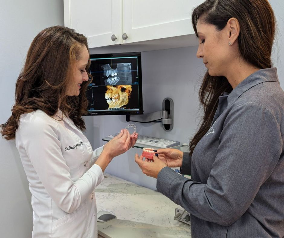 Dr. Pinto assessing a guest's bite